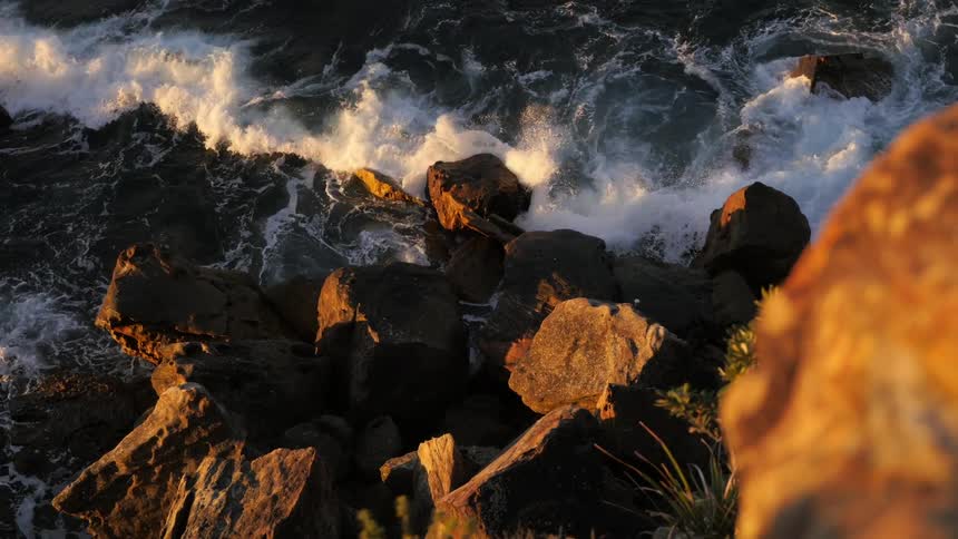 Waves crash onto a rocky coast