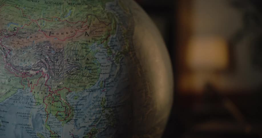 A round world globe is on the table