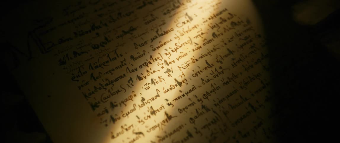 A person reaches their arm over the old document