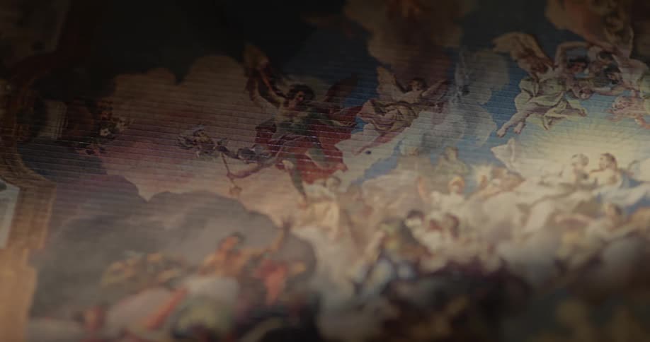 Close up of an artistic surface with a painting of angels in the sky