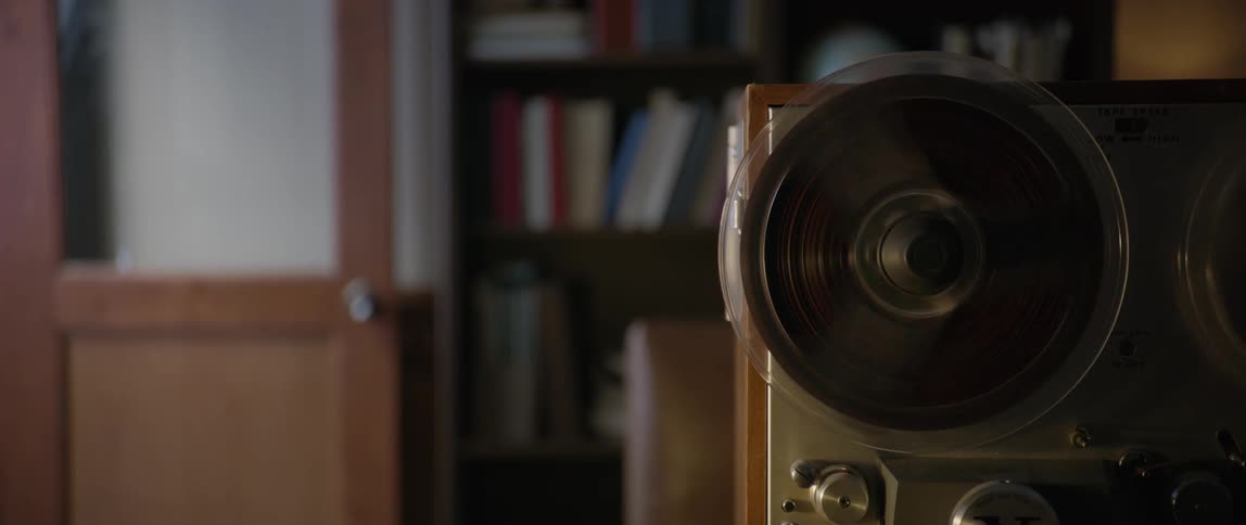 The tape recorder reels are spinning