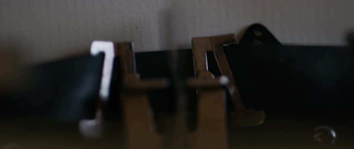 Close up of a typewriter as the word atlanta is typed onto the paper