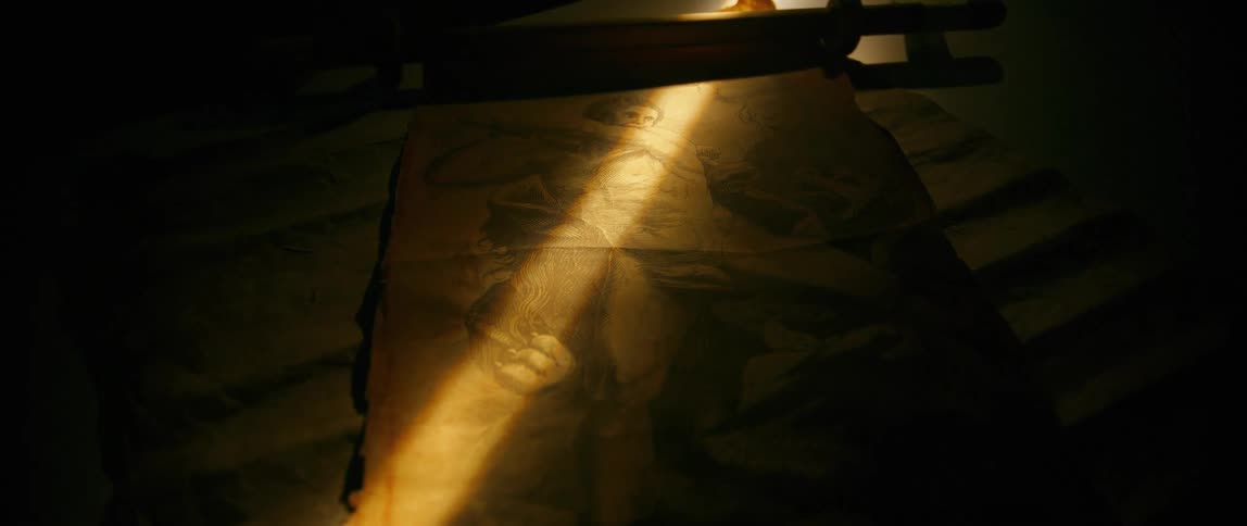 Art on a papyrus on the table with a beam of natural light