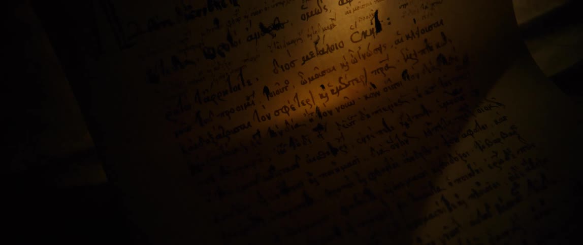 A hand picks the corner of a page up