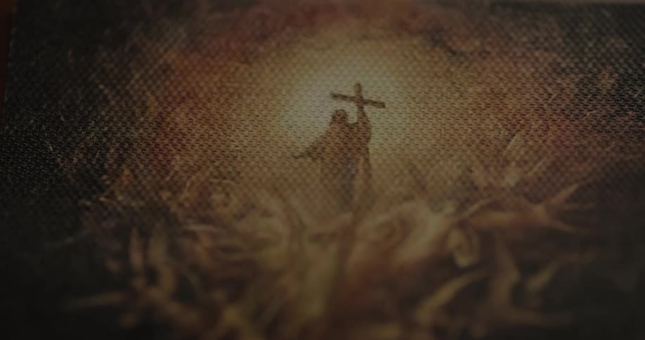 Close up of an artwork of jesus christ holding the cross