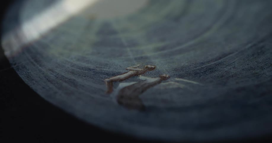 Close up of an artistic blue circle with two people drawn on it