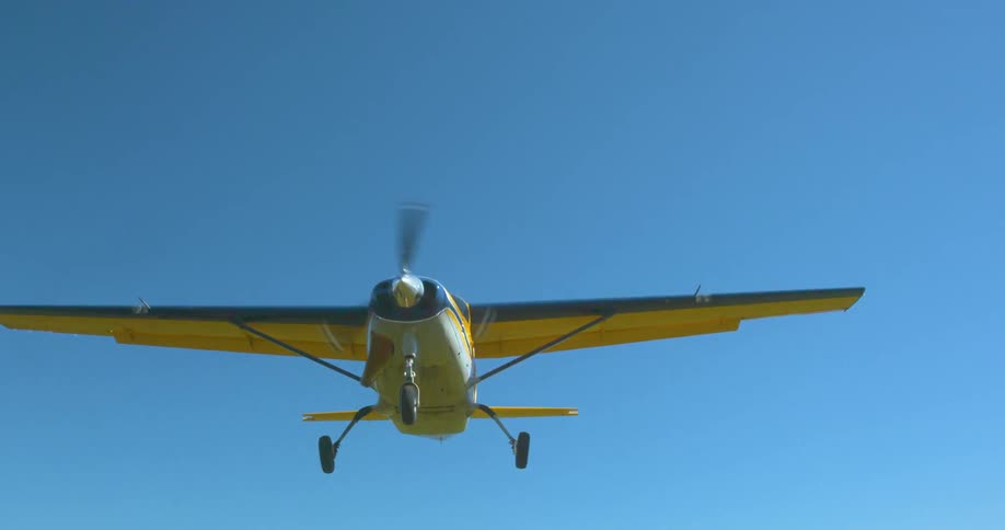 Small airplane flying in the sky on a clear day