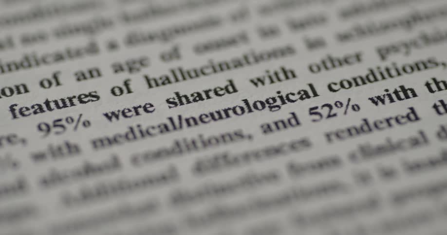 Closeup of a research document featuring statistical text printed on a book page
