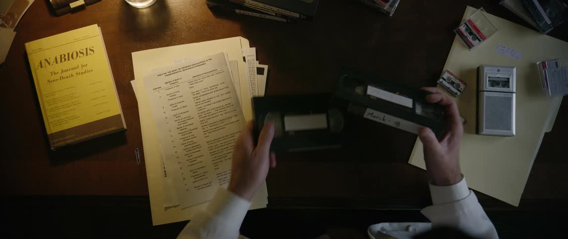 Person handling vintage analog video tapes
