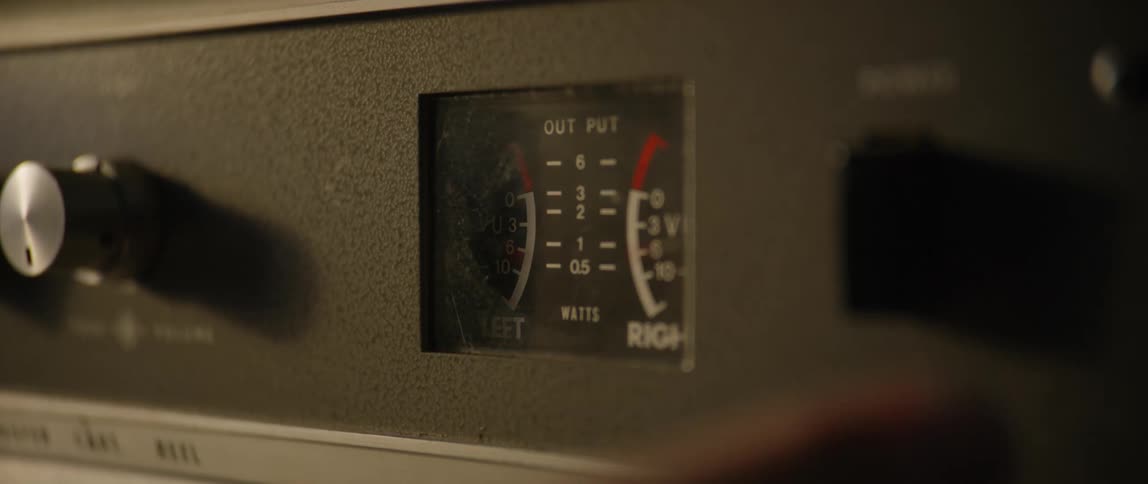 Finger interacting with vintage frequency radio