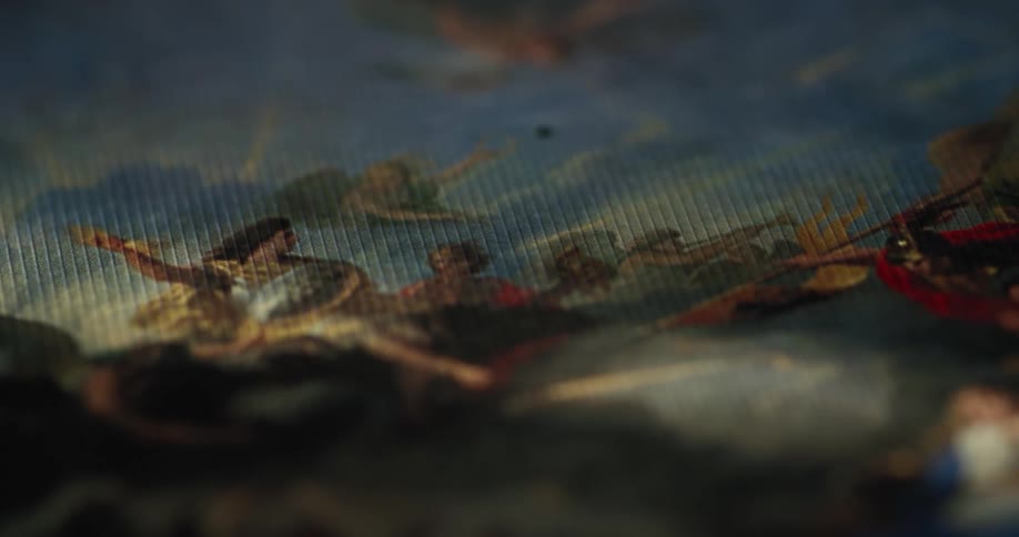 A colorful painting is in the dark area