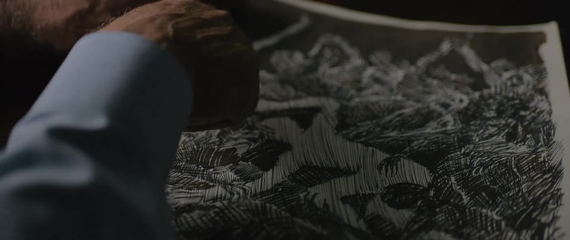 A footage of a person looking at an artwork
