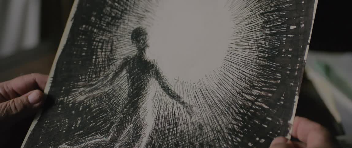 Black and white drawing of a man kneeling in front of a light