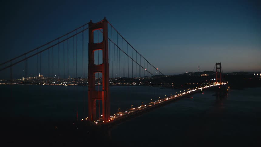 Golden gate bridge view at night with vehicle traffic