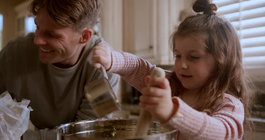 A girl mixes milk in the pot