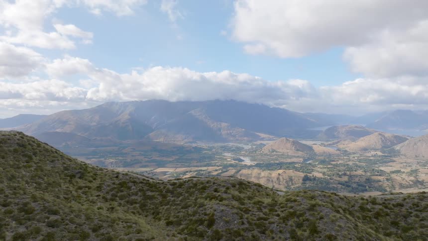 Aerial panorama of a mountain valley on a partly cloudy day