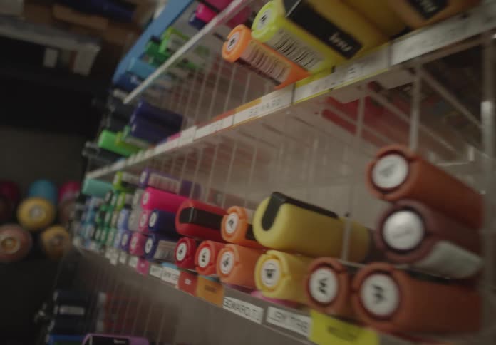 Close up of a shelf with various pens in a store