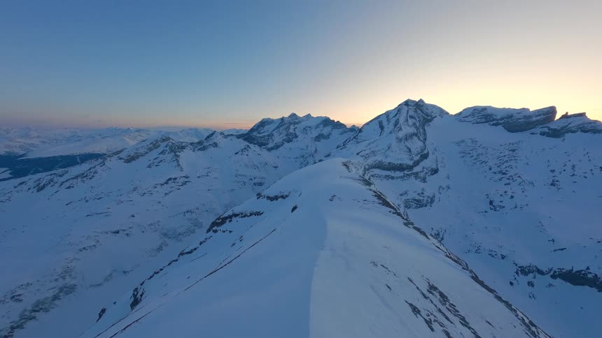 Scenery of Swiss snowcapped mountain peaks at sunrise