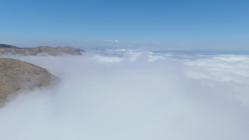 Mountains and clouds under a blue sky