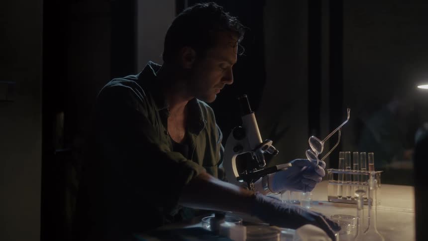 A scientist is working at night in the lab