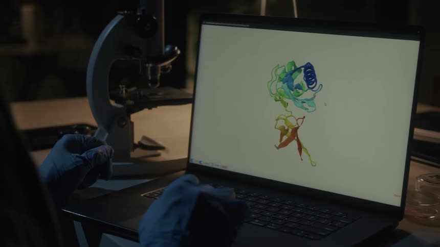 A scientist interacting with a  3D model of a protein