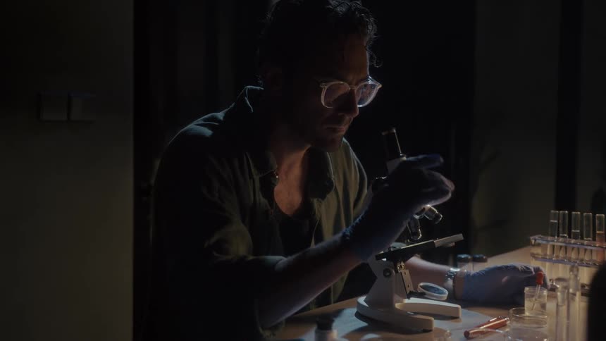 A scientist is working in the lab at night
