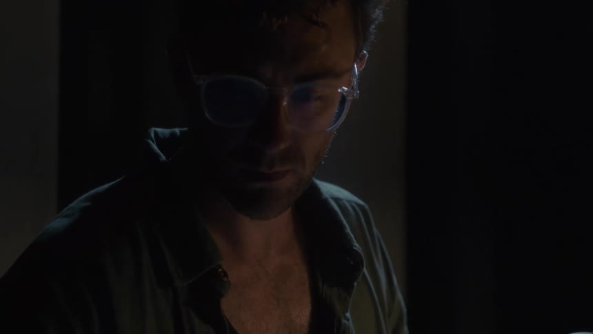 The scientist is looking with microscope slides