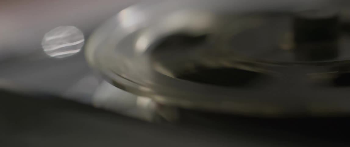 The tape reels are spinning on the tape recorder