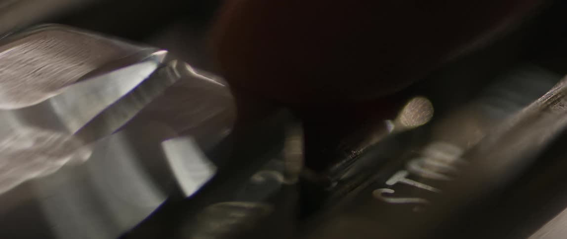 A person presses a button on a machine