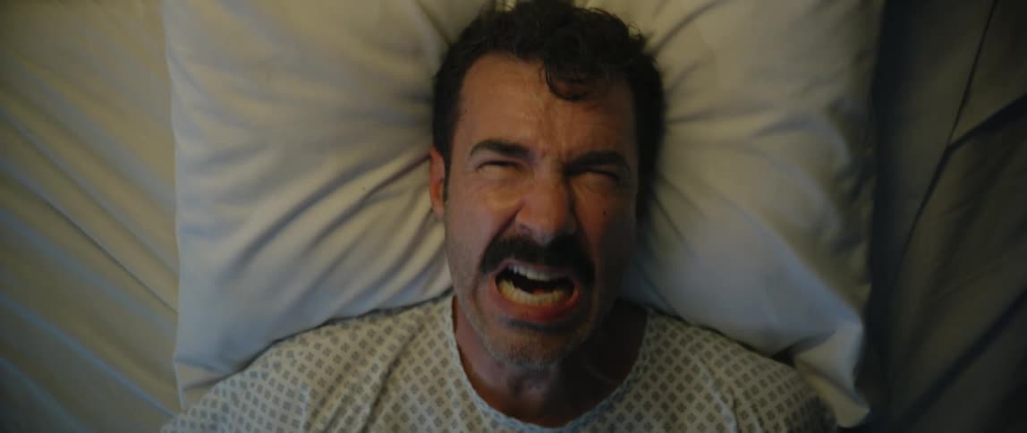 A patient in the hospital is screaming in pain