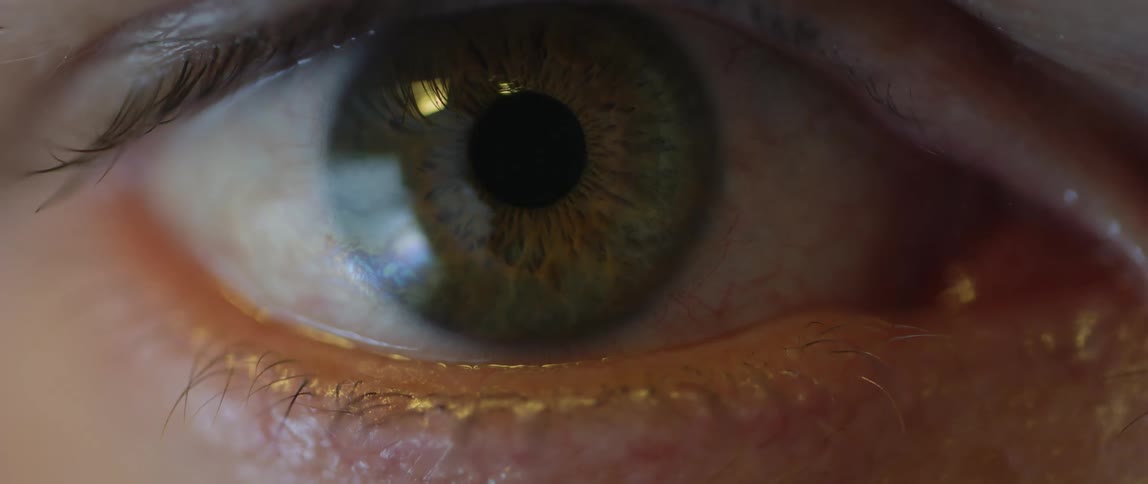 Extreme close up of person opening up their eye