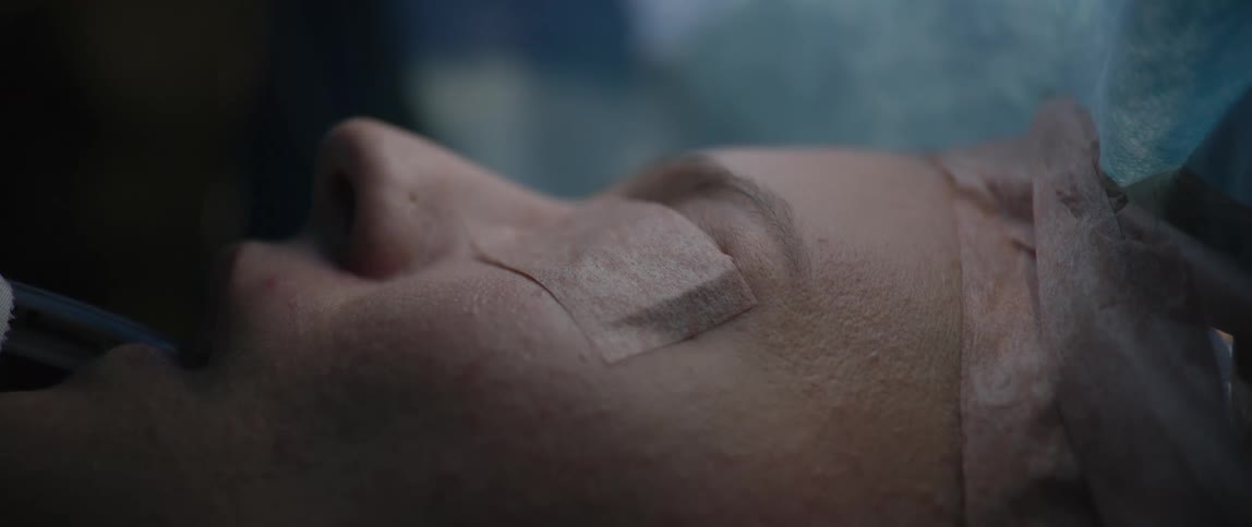 A woman gets her eyes banded shut in the hospital