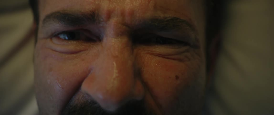 Closeup of a sweaty mans head