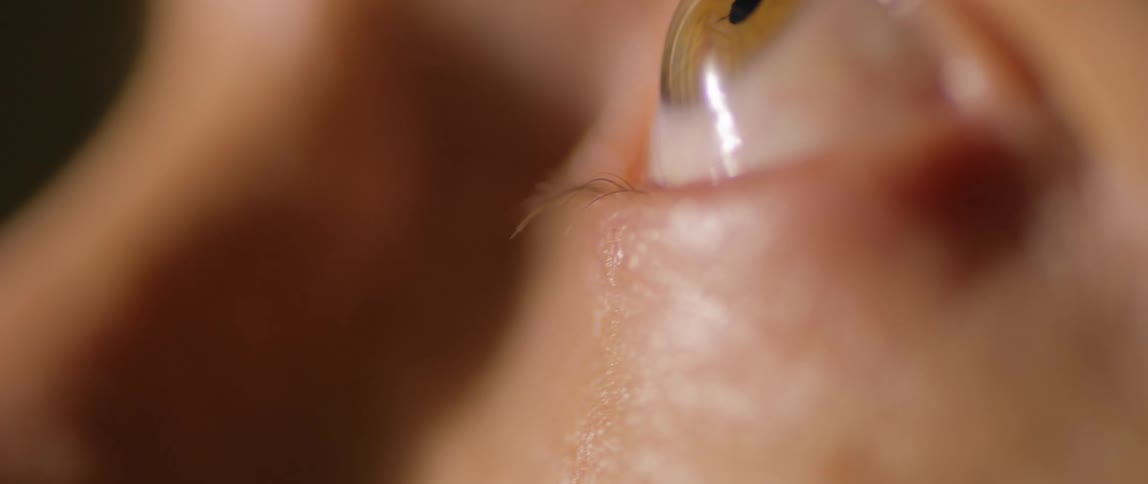 A person looks up and down as they blink