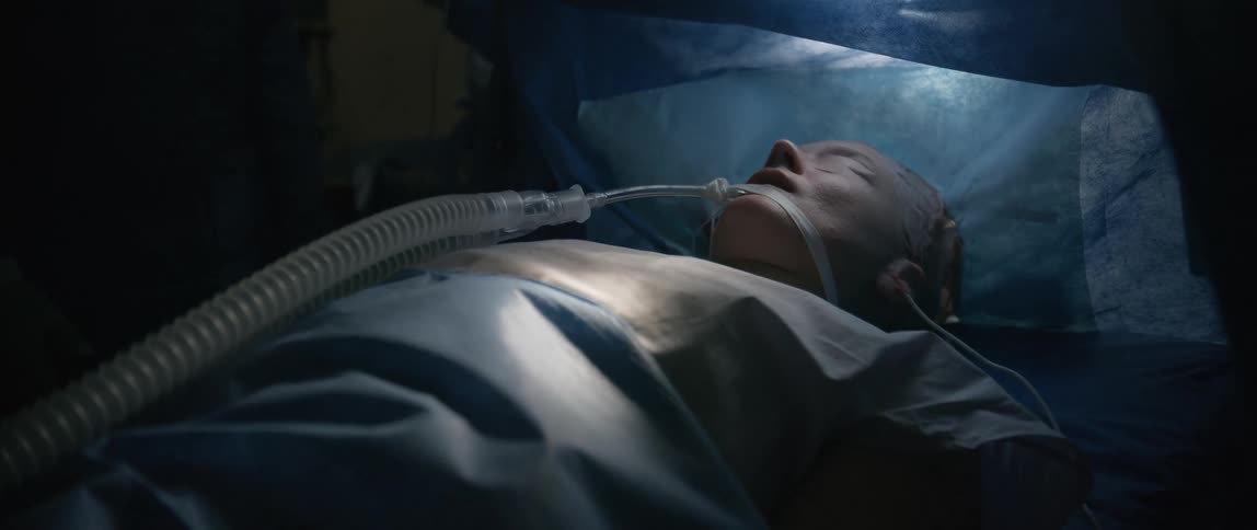 A patient in the operating room has a breathing tube