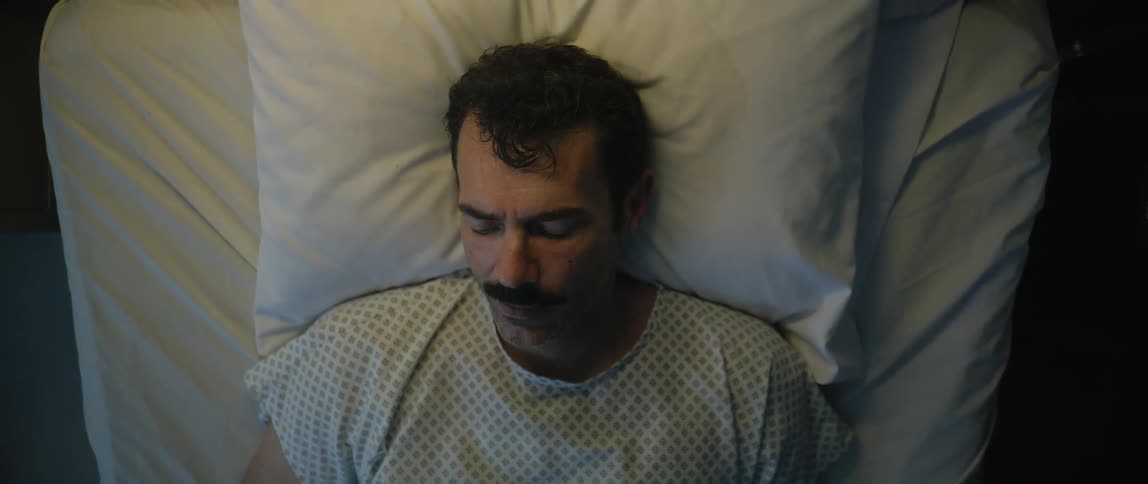 The hospital patient is sleeping in bed