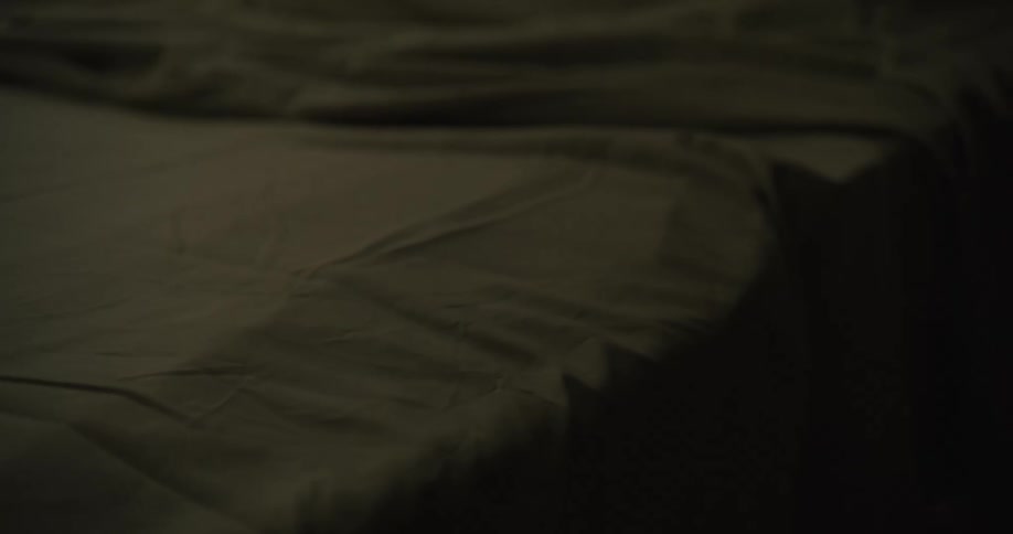 Close up of a bed with messy sheets