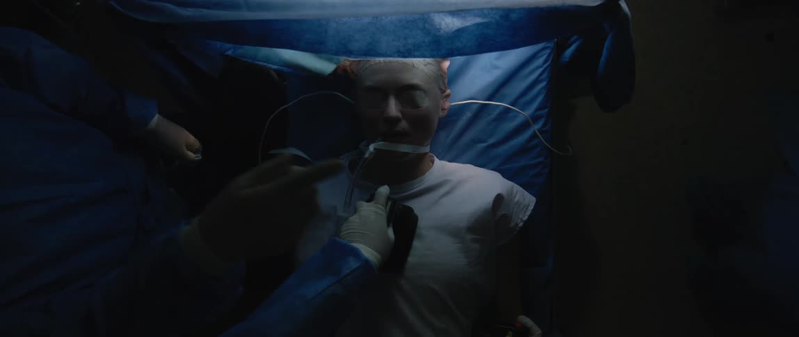 Medical professionals in the hospital attempt to rescue a patient with defibrillator paddles