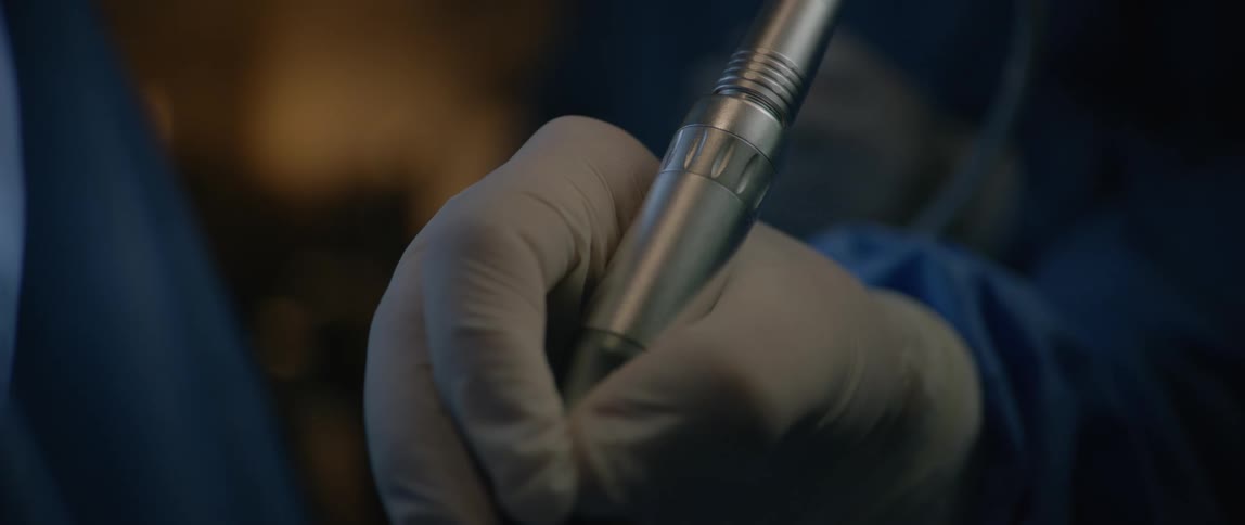 A dentist uses his drill