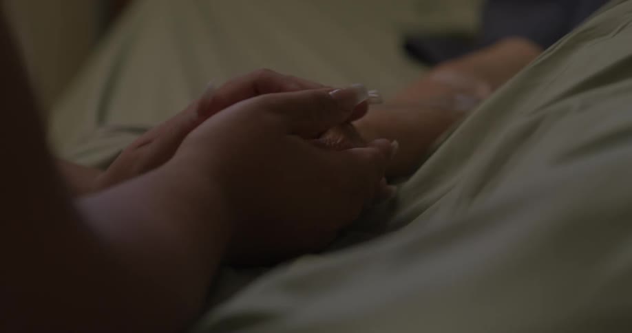 A person holds a patients hand