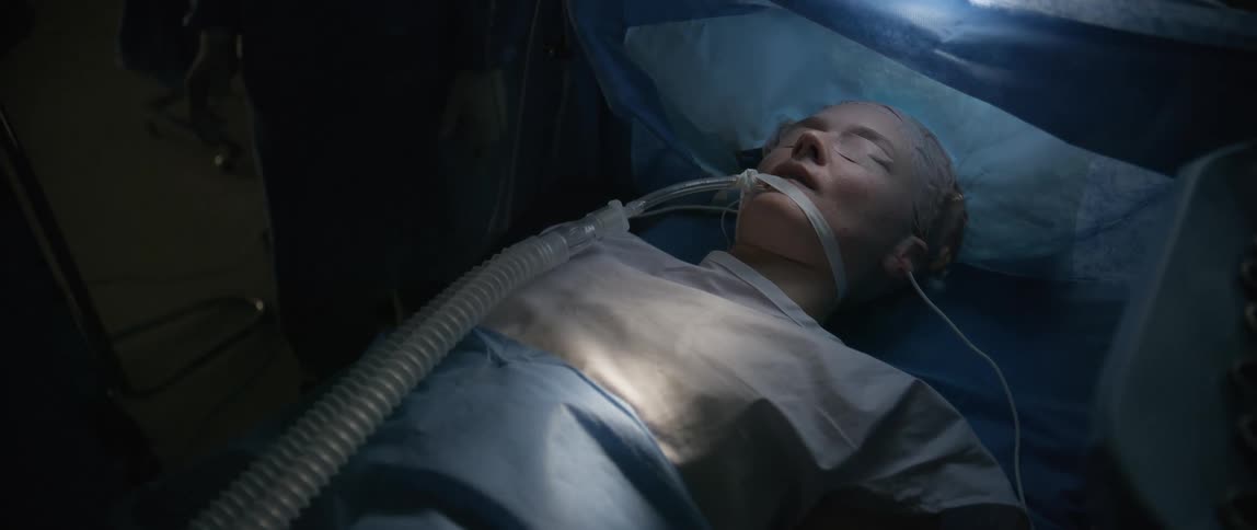 A woman being prepped for surgery while on the operating table