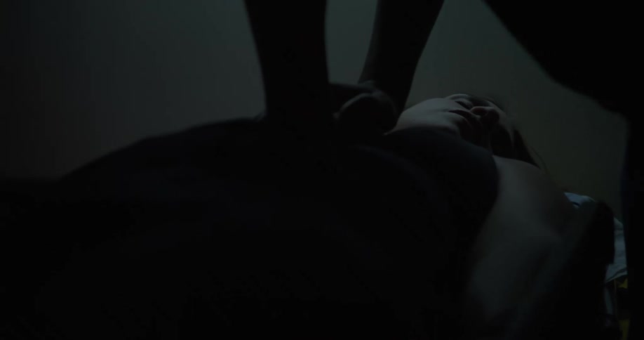 A woman is shocked with a defibrillator and given chest compressions
