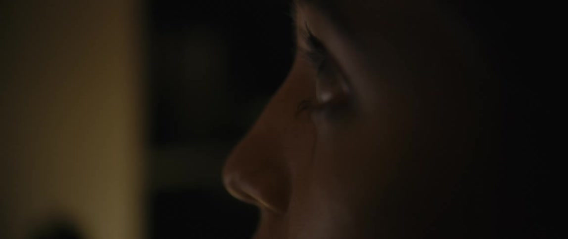 A person looks down and into the distance
