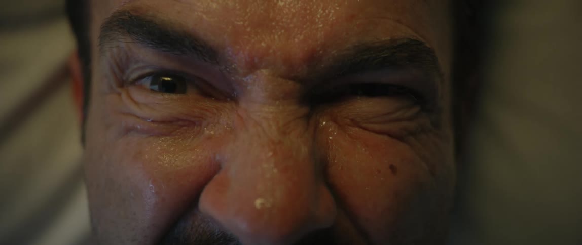 A man winces in pain