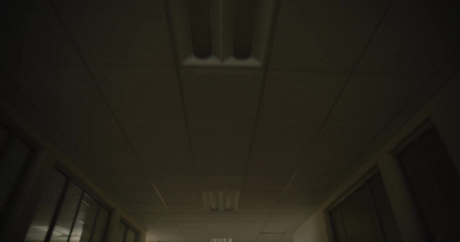 The empty hallway in the hospital is dark