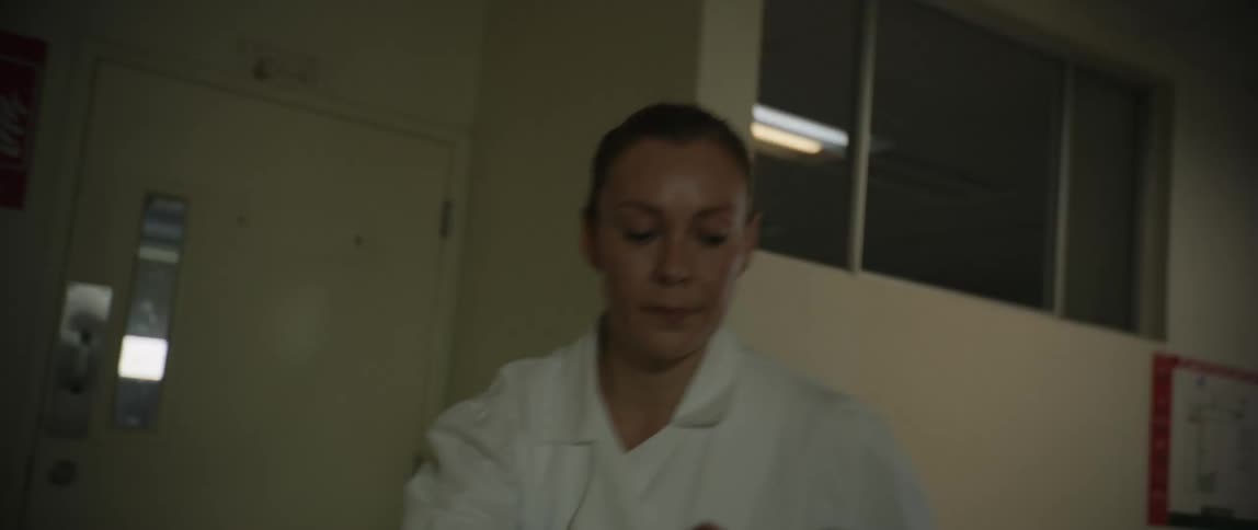 A patient being taken to the operating room by a nurse