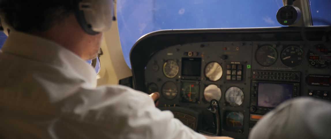 Pilot in a flight simulation flying an airplane in the cockpit