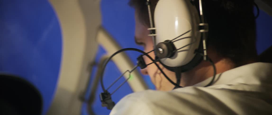 A pilot is very nervous because of the turbulence while flying