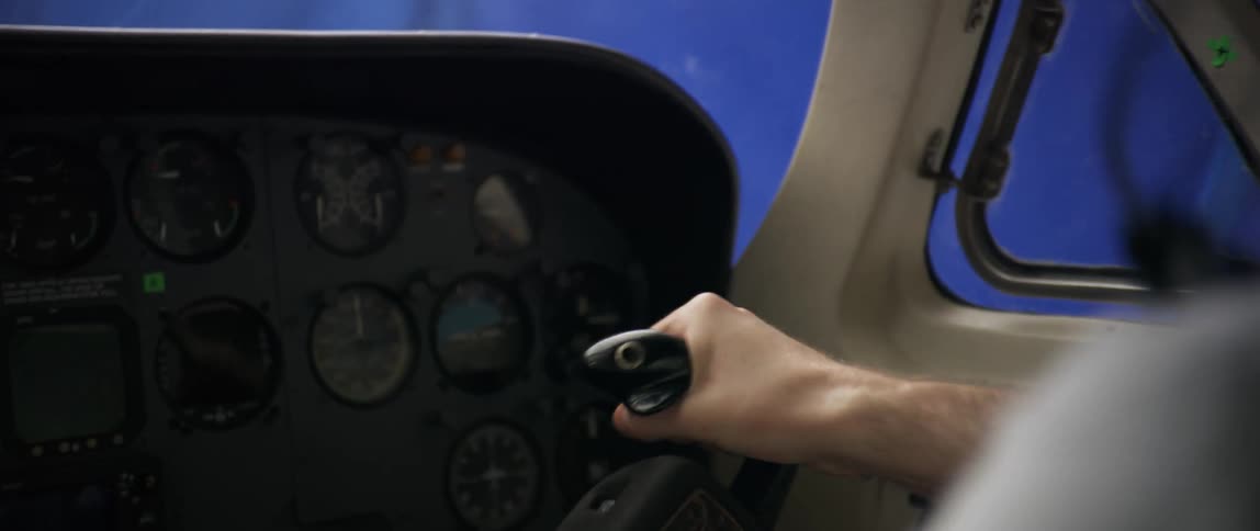 Plane shakes while a pilot sitting in its cockpit manipulates the yoke