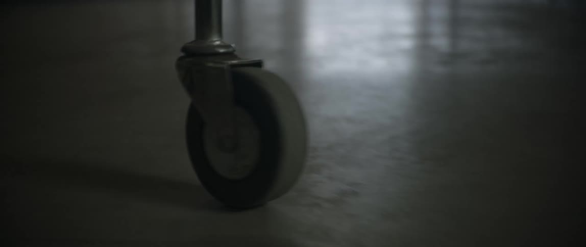 Stretcher wheels rolling through the hospital corridors